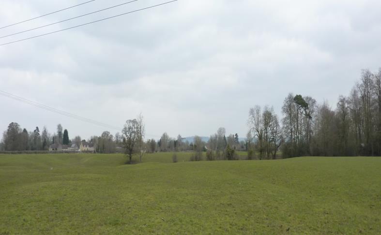 View 3 Northwards towards the village from the field north of Kilverts Parsonage driveway bordering the B4069 (from footpaths LBUR21 or LBUR23)